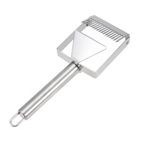 Comb uncapping with scrapper